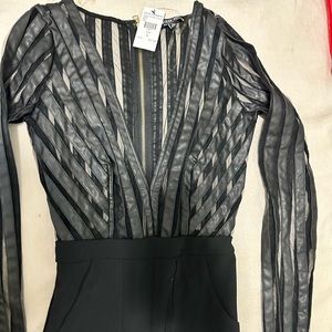 It’s called Russian Roulette Jumpsuit in Black from Fashion Nova.